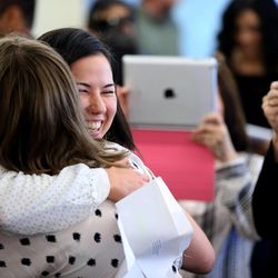 University of Utah medical student Amanda Berbert gets a hug after opening her letter and learning that she is headed for residency at the Valley Medical Center in Washington during Match Day at the University of Utah in Salt Lake City on Friday, March 20, 2015.  