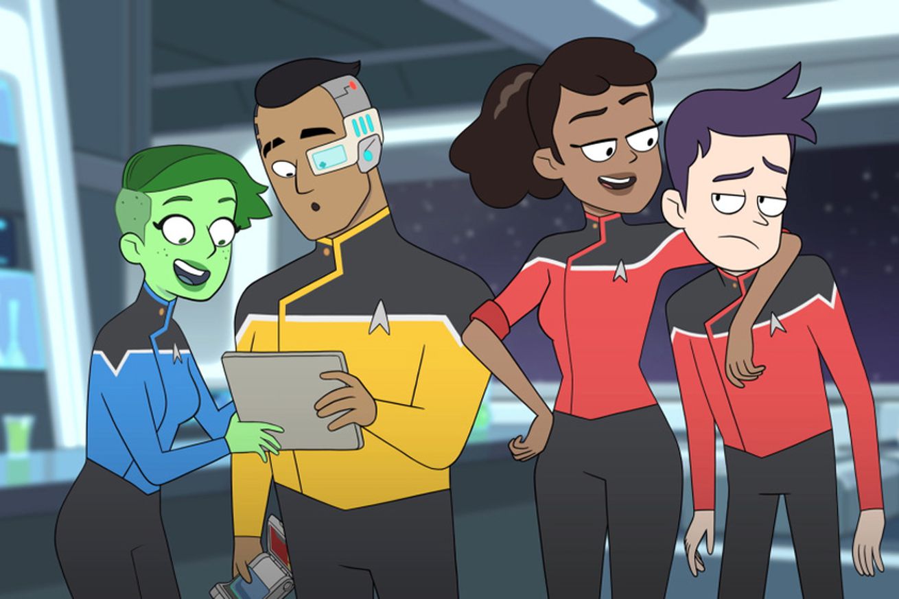 From left to right: a green humanoid woman in black pants and a blue shirt, a man with an undercut wearing black pants and a yellow shirt, a woman wearing black pants and a red shirt with her sleeves rolled up, and an uncomfortable looking person with purple hair, black pants, and a red shirt.