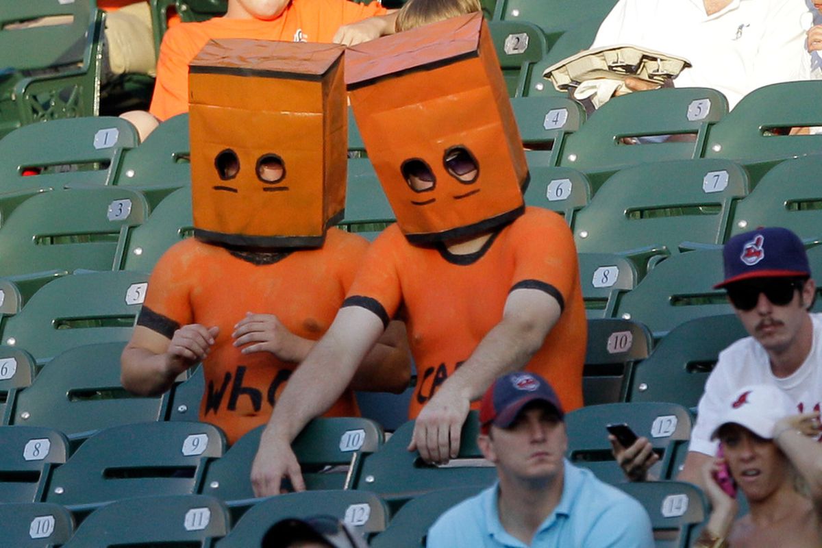 Oriole fans in their native garb.  (Photo by Rob Carr/Getty Images)