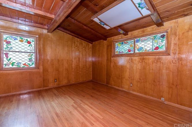 Wood-paneled room with stained glass