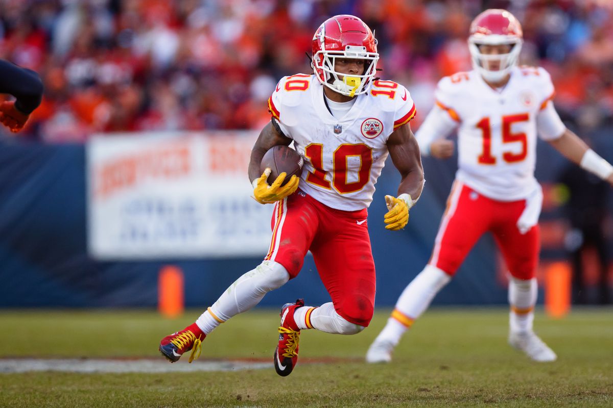 DENVER, CO - DECEMBER 11: Running back Isiah Pacheco #10 of the Kansas City Chiefs runs with the football against the Denver Broncos in the first half at Empower Field at Mile High on December 11, 2022 in Denver, Colorado.
