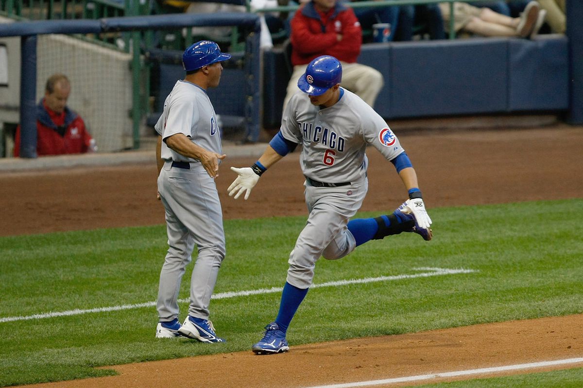 Bryan LaHair of the Chicago Cubs is congratulated by Pat Listach after hitting a home run against the Milwaukee Brewers at Miller Park in Milwaukee, Wisconsin. The Cubs defeated the Brewers 10-0. (Photo by Scott Boehm/Getty Images)