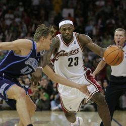 Cleveland Cavaliers' LeBron James (23) starts a drive on Utah Jazz's Andrei Kirilenko (47), of Russia, during an NBA basketball game Saturday, March 17, 2007, in Cleveland. 