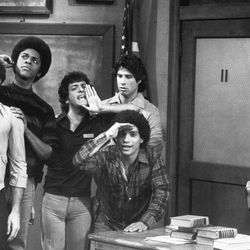 This 1978 file photo originally from ABC shows members of the cast of television sitcom "Welcome Back, Kotter", from left, Stephen Shortridge as Beau De Labarre, Lawrence Hilton-Jacobs as Freddy Washington, Ron Palillo as Arnold Horshack, Robert Hegyes as Juan Epstein, foreground, John Travolta,rear, as Vinnie Barbarino and Gabe Kaplan as Gabe Kotter.