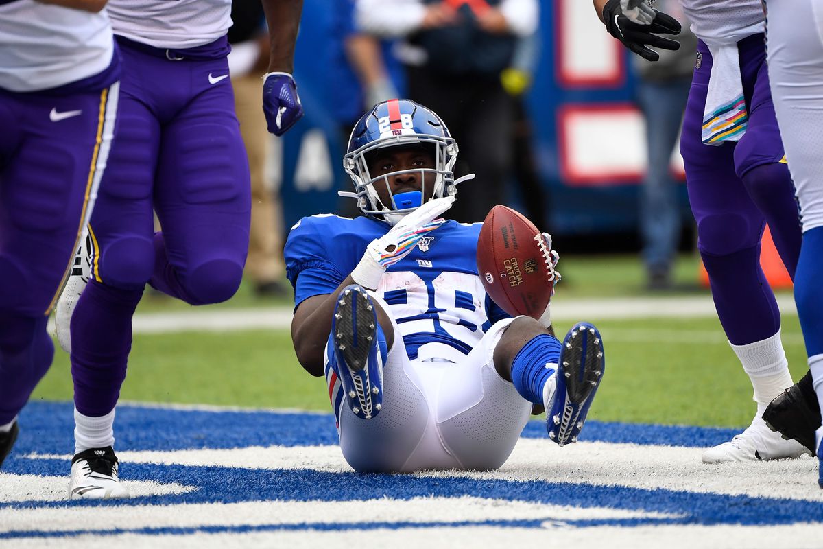New York Giants running back Jon Hilliman is tackled in the end zone for a Minnesota Vikings safety in the 1st half at MetLife Stadium.
