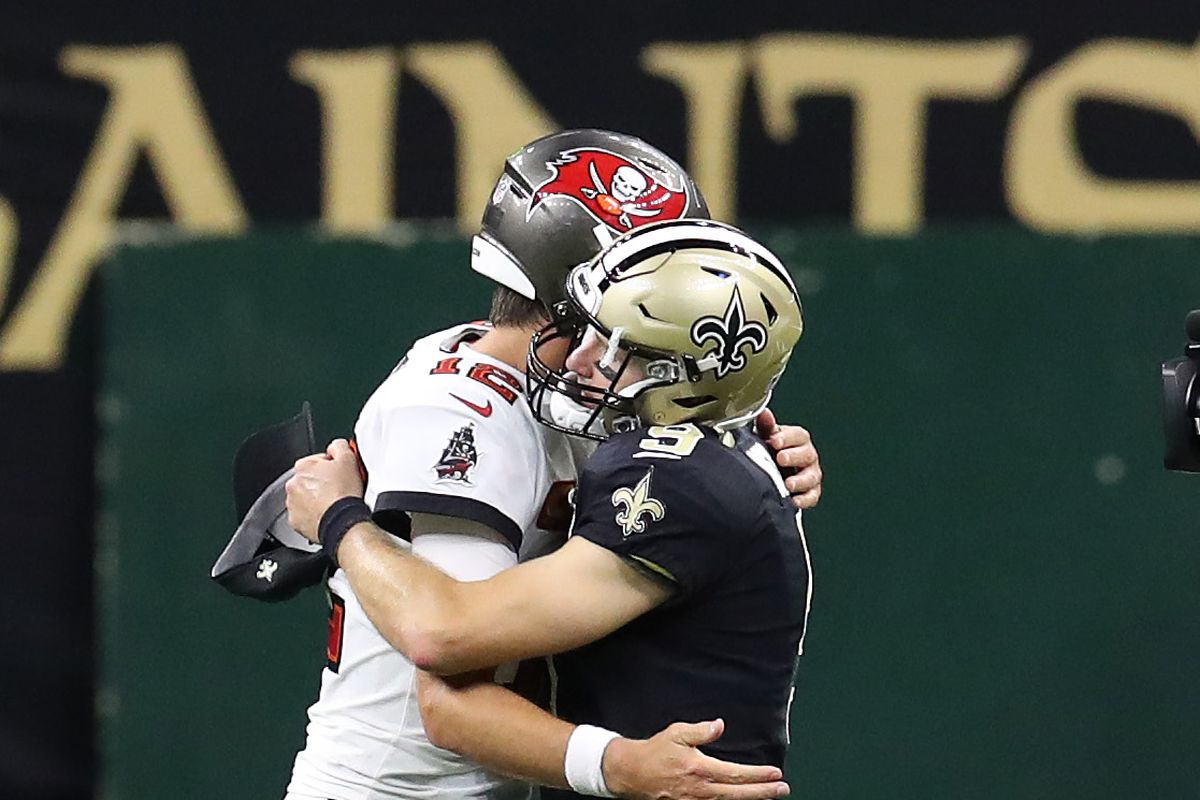 Tom Brady #12 of the Tampa Bay Buccaneers hugs Drew Brees #9 of the New Orleans Saints following a game at the Mercedes-Benz Superdome on September 13, 2020 in New Orleans, Louisiana.