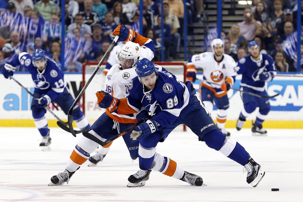Nikita Nesterov fights for puck possession in the Lightning's 5-3 loss in Game 1 of their series with the New York Islanders