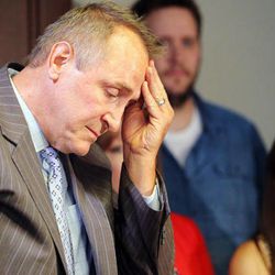 Following his statement, former Utah Attorney General Mark Shurtleff rubs his head at the law offices of Snow, Christensen & Martineau in Salt Lake City Tuesday, July 15, 2014. 