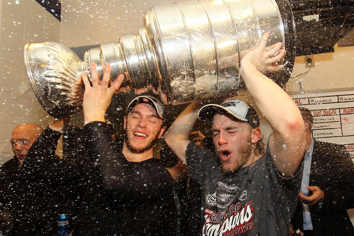 Jonathan Toews and Patrick Kane get a golden shower after winning the Cup. Of champagne, of champagne!