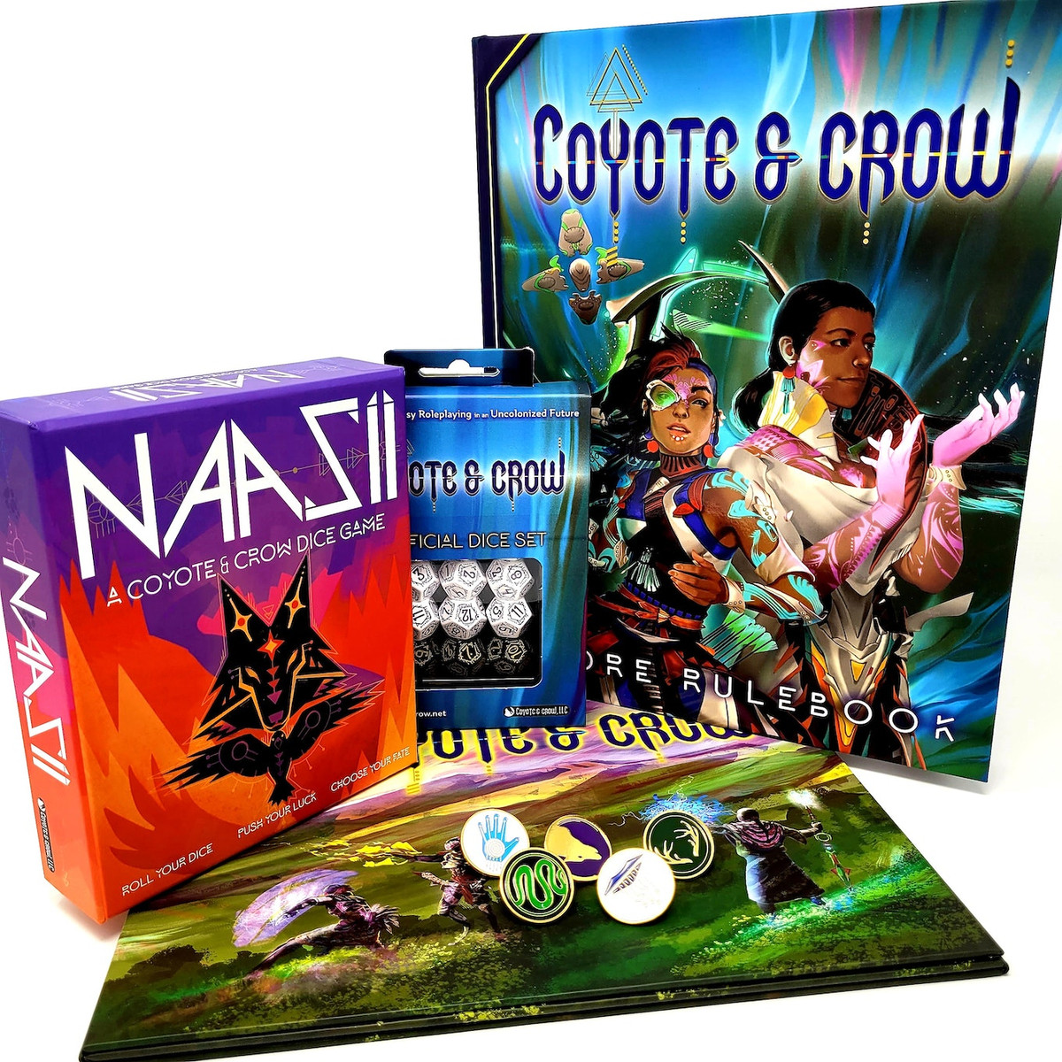 A stock photo of the Coyote &amp; Crow core rulebook, dice game, DM screen, enamel pins, and custom dice