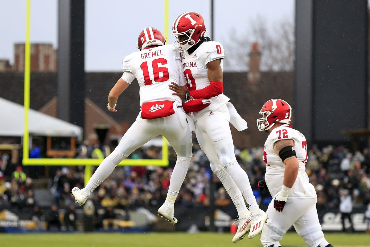 Grant Gremel #16 and Donaven McCulley #0 of the Indiana Hoosiers celebrate a touchdown during the first quarter in the game against the Purdue Boilermakers at Ross-Ade Stadium on November 27, 2021 in West Lafayette, Indiana.