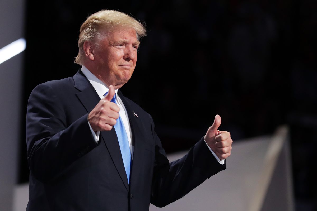 Presumptive Republican presidential nominee Donald Trump gives thumbs up while introducing his wife Melania on the first day of the Republican National Convention on July 18, 2016, at the Quicken Loans Arena in Cleveland, Ohio. 