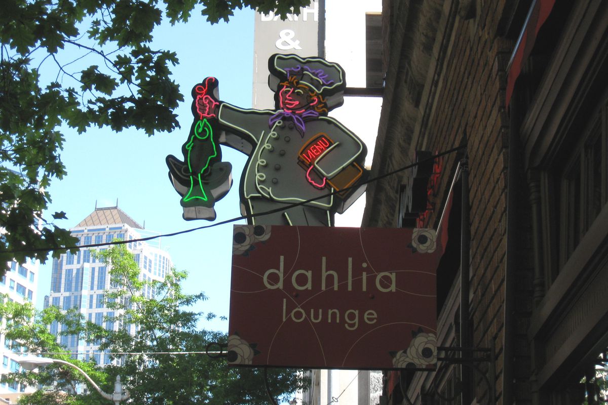 The famed neon sign —&nbsp;with a chef holding a fish — outside Dahlia Lounge in downtown Seattle