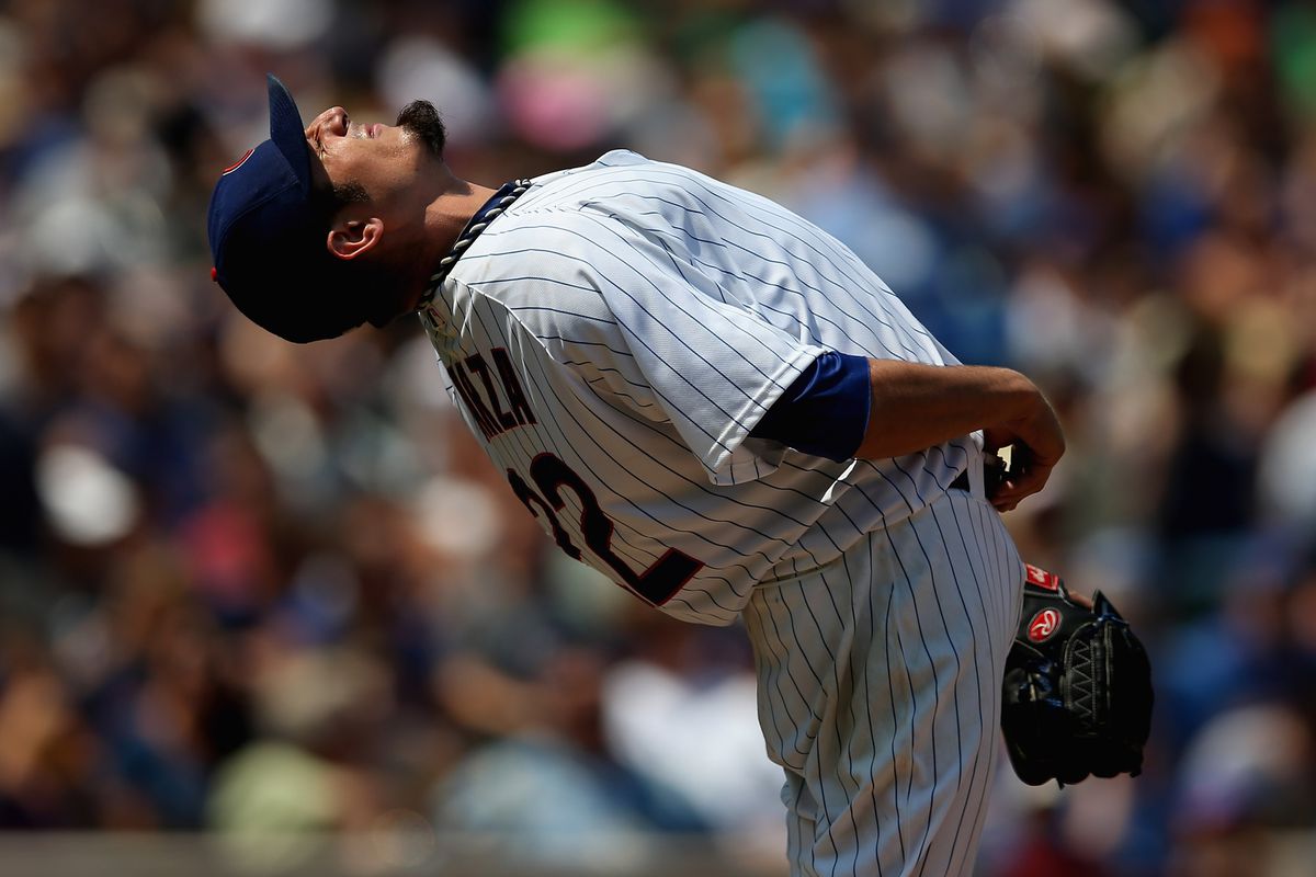 Starting pitcher Matt Garza of the Chicago Cubs stretches before throwing against the Arizona Diamondbacks at Wrigley Field in Chicago, Illinois.  (Photo by Jonathan Daniel/Getty Images)
