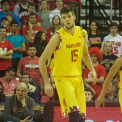 Michal Cekovsky and Melo Trimble look on.
