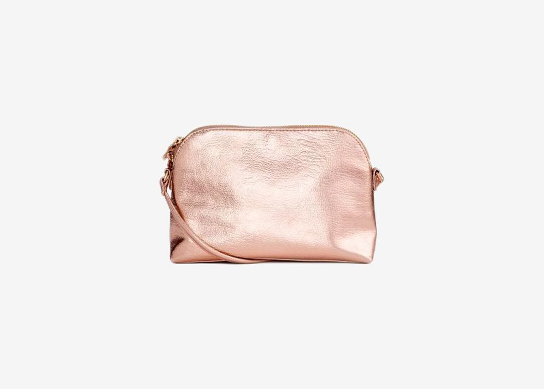 Metallic pink crossbody bag.