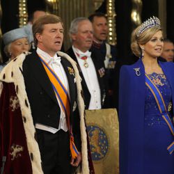 Dutch King Willem-Alexander and his wife Queen Maxima sing hymns at the Nieuwe Kerk or New Church in Amsterdam, The Netherlands, prior to the inauguration of King Willem-Alexander Tuesday April 30, 2013. Around a million people are expected to descend on the Dutch capital for a huge street party to celebrate the first new Dutch monarch in 33 years. 