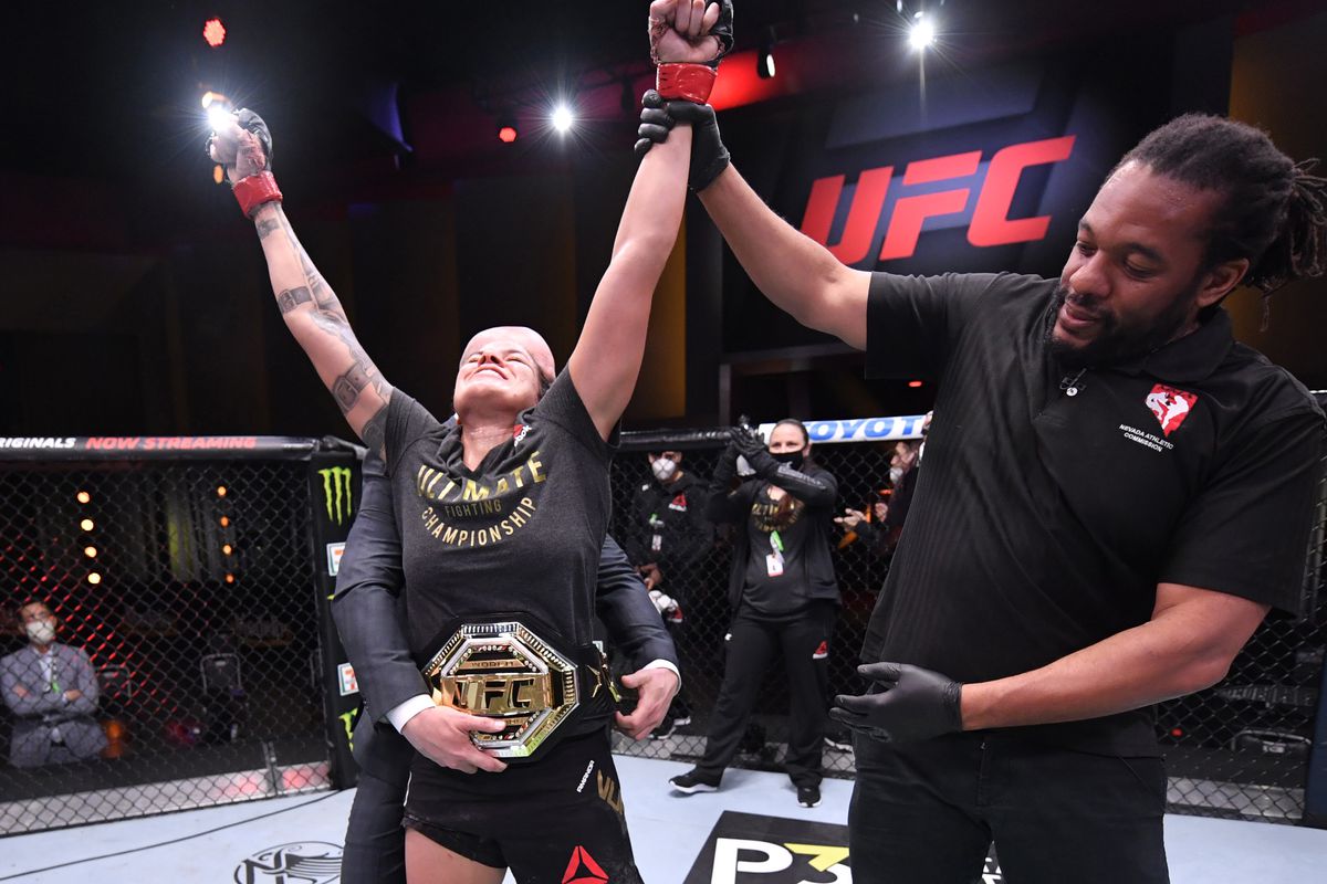 Amanda Nunes of Brazil celebrates after her unanimous-decision victory over Felicia Spencer of Canada in their UFC featherweight championship bout during UFC 250 at the UFC APEX.