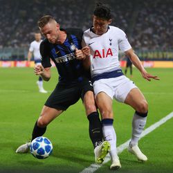 Milan Skriniar of Inter Milan battles for possession with Heung-Min Son of Tottenham Hotspur during the Group B match of the UEFA Champions League between FC Internazionale and Tottenham Hotspur at San Siro Stadium on September 18, 2018 in Milan, Italy.