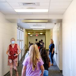 A third grade class walks through the hallway during the first day of school at Virginia Court Elementary School. Students came back to a campus that was remodeled and expanded over the summer.