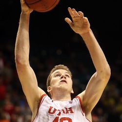 Utah Utes forward Jakob Poeltl (42) drives toward the rim during the overtime period of a Pac-12 conference tournament semifinal against the Cal Bears at the MGM Grand Garden Arena in Las Vegas, Friday, March 11, 2016.