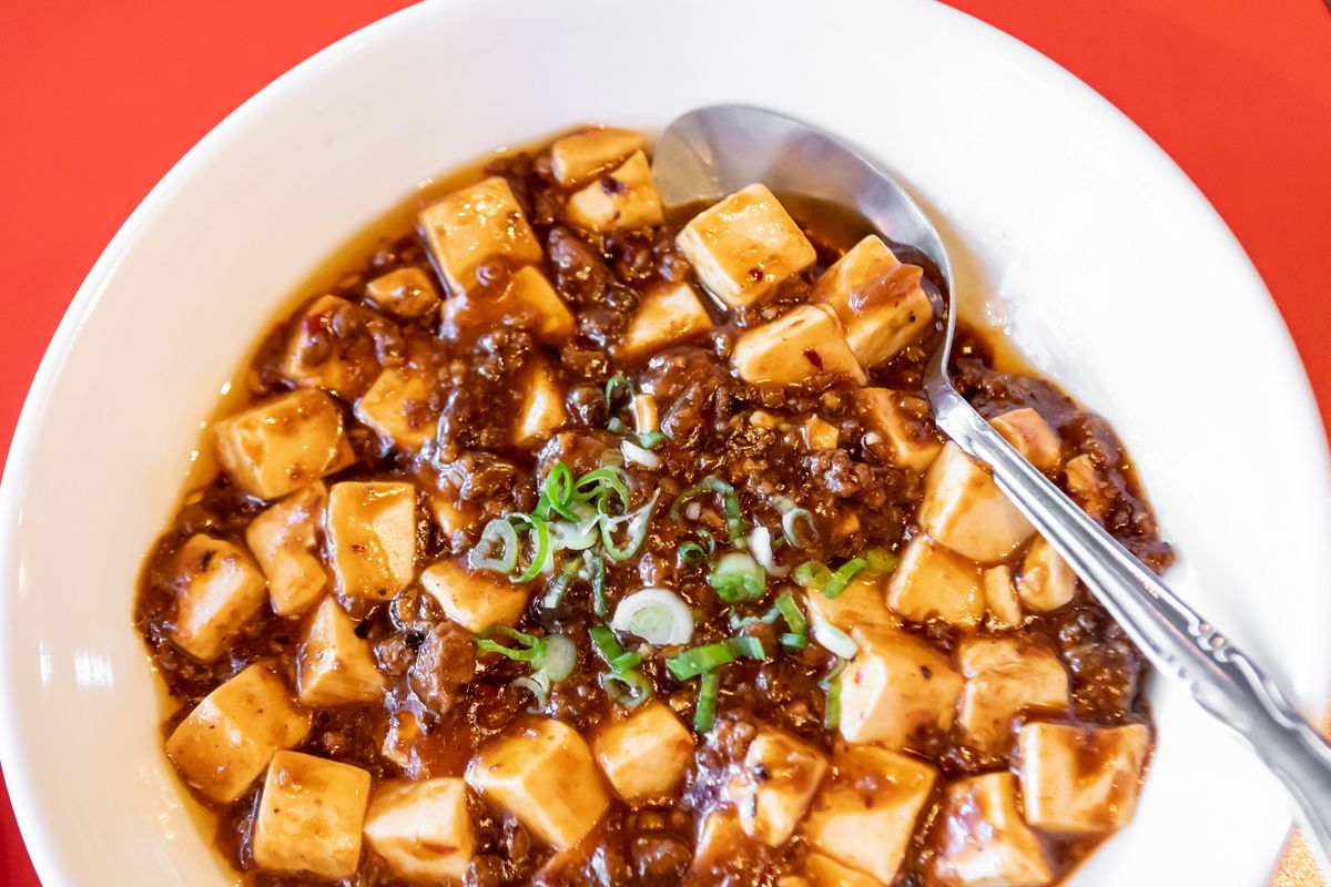 Mapo tofu with a spoon in it
