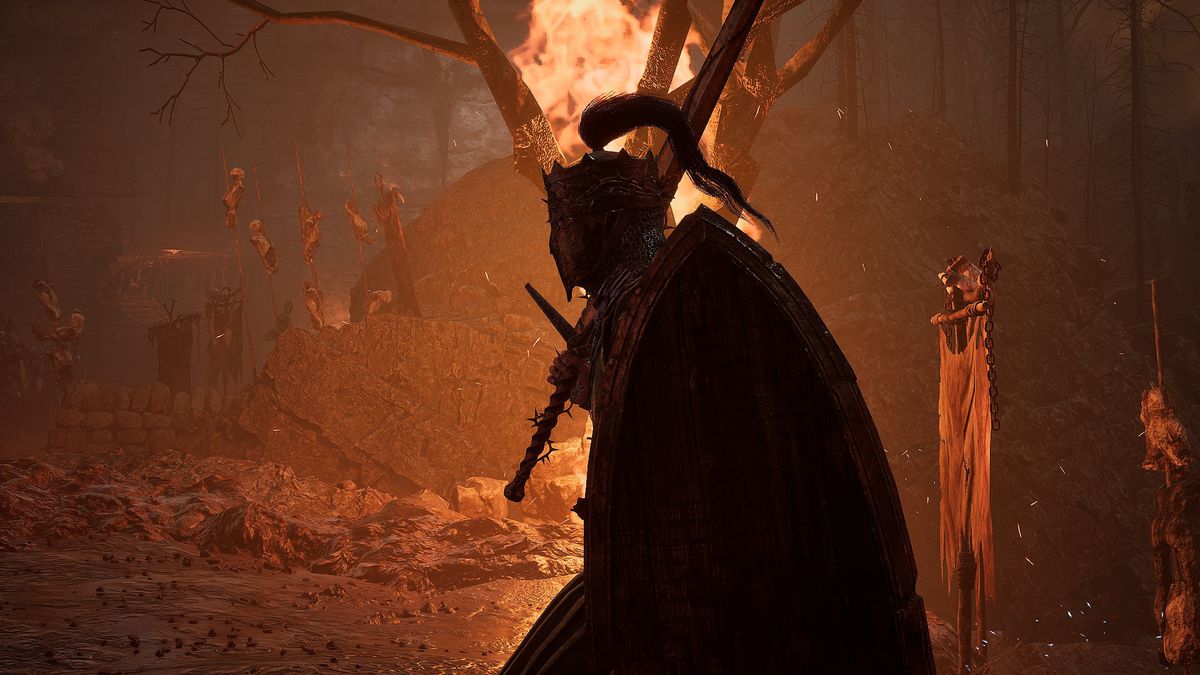 A knight with a broadsword over their shoulder walks in the foreground, backlit by fires in the darkness