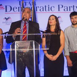 Salt Lake County District Attorney Sim Gill, his wife, Jamie Tabish, and their children Anjali and Vik are on stage as Democrats gather Tuesday, Nov. 4, 2014, in Salt Lake City. 