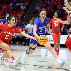 Utah Utes guard Ines Vieira (2) knocks the ball away from BYU Cougars guard Shaylee Gonzales (2) as Utah and BYU women compete in a basketball game at the Huntsman Center in Salt Lake City on Saturday, Dec. 4, 2021.