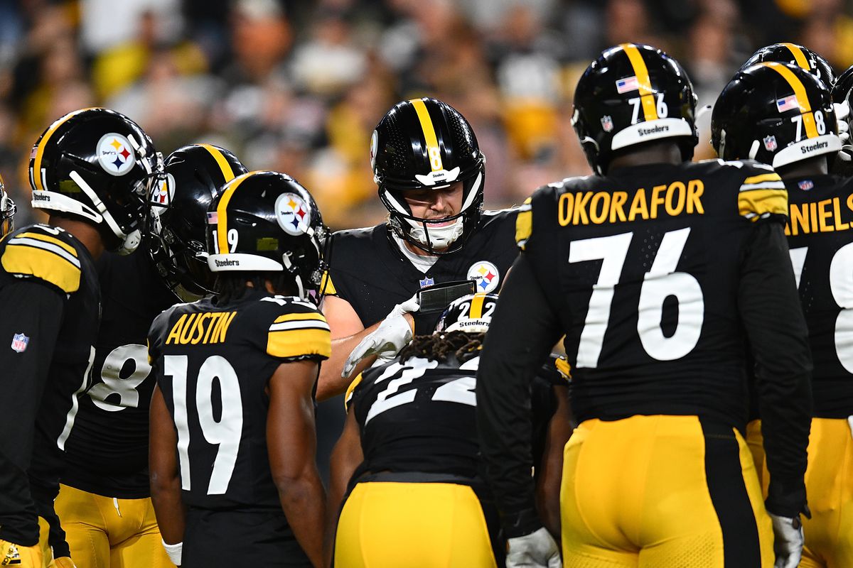 Kenny Pickett #8 of the Pittsburgh Steelers huddles with teammates during the game against the Cleveland Browns at Acrisure Stadium on September 18, 2023 in Pittsburgh, Pennsylvania.