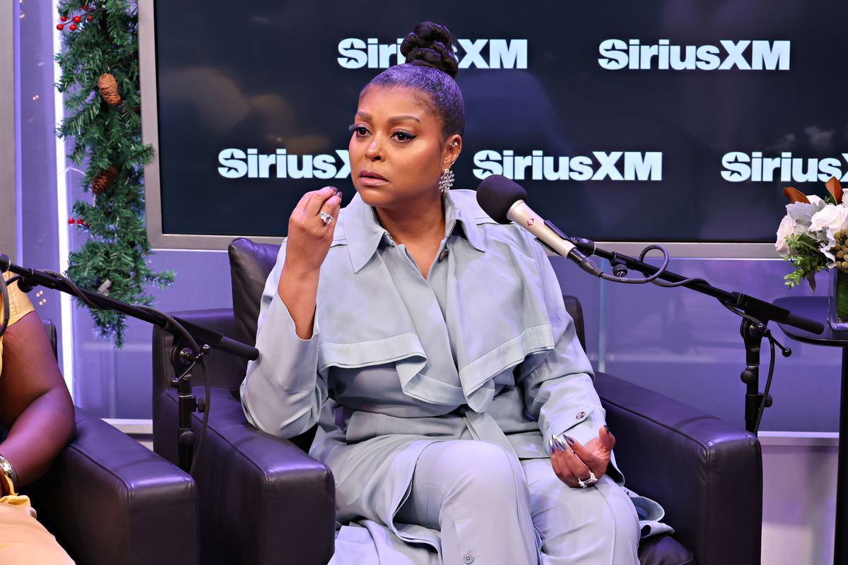 A photo of actress Taraji P. Henson sitting in front of a microphone being interviewed on Sirius XM Radio