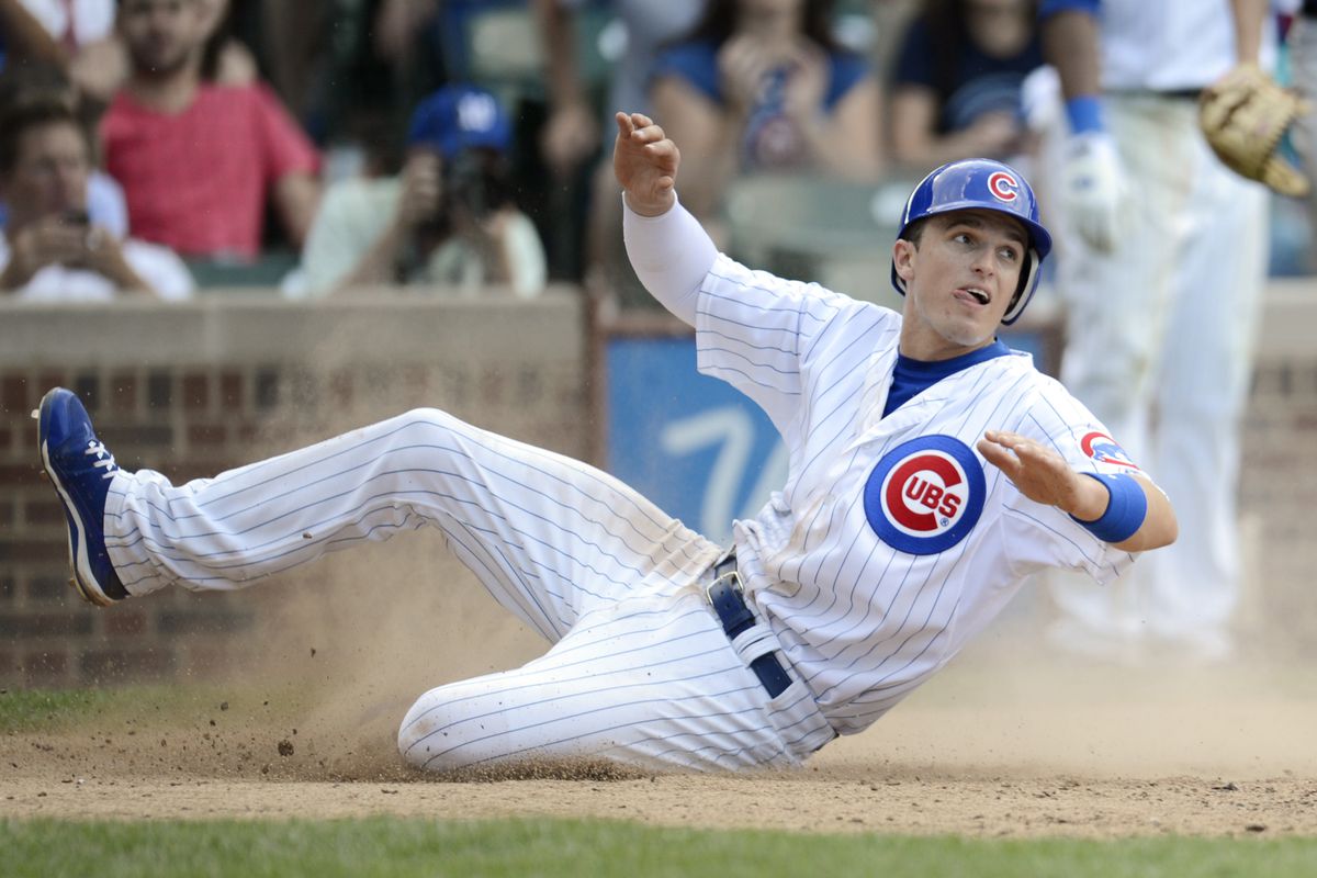 Aug 24, 2012; Chicago, IL, USA; Chicago Cubs third baseman Josh Vitters reacts after being tagged out at home by the Colorado Rockies during the eighth inning at Wrigley Field.  The Cubs won 5-3. Mandatory Credit: Jerry Lai-US PRESSWIRE
