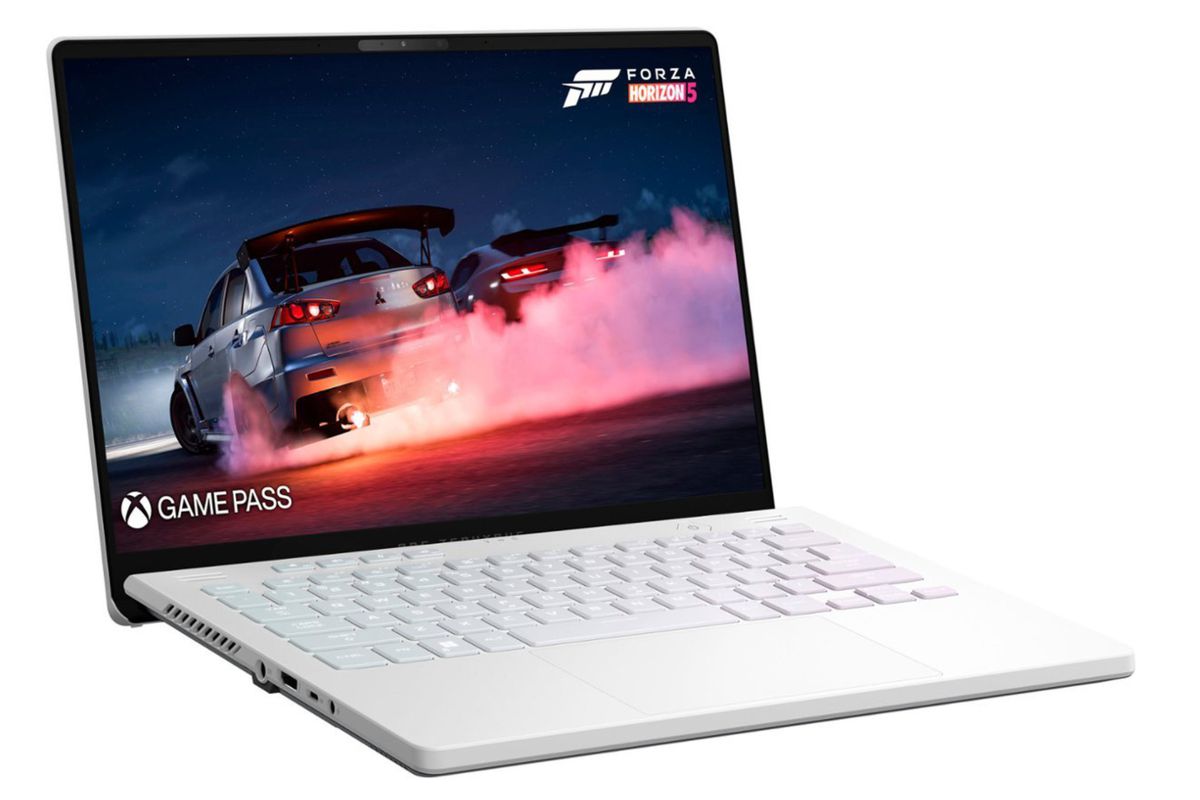 The Asus ROG Zephyrus G14 is shown at a side view. A still shot of Forza Horizon 5 is displayed on its screen.