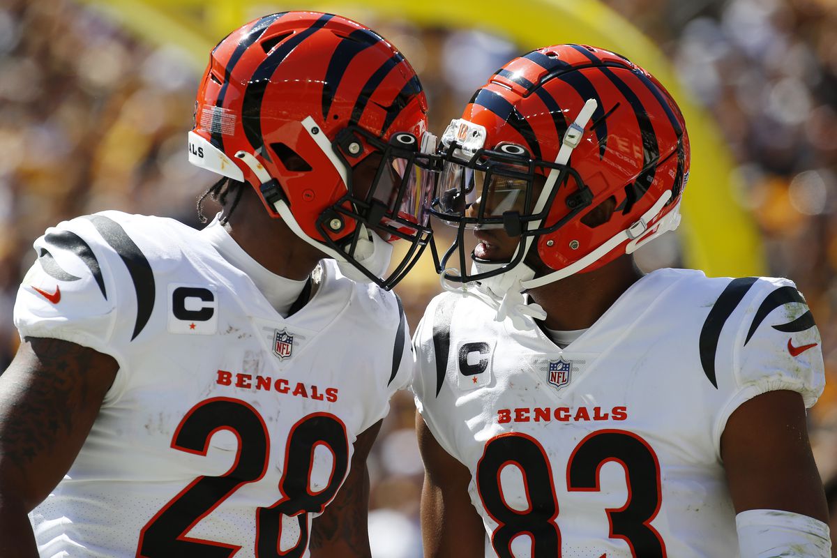Tyler Boyd #83 of the Cincinnati Bengals celebrates a touchdown with Joe Mixon #28 of the Cincinnati Bengals during the first quarter in the game against the Pittsburgh Steelers at Heinz Field on September 26, 2021 in Pittsburgh, Pennsylvania.  &nbsp;   