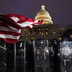 Police stand outside the Capitol after a day of rioting by protesters on Wednesday, Jan. 6, 2021, at the Capitol in Washington.