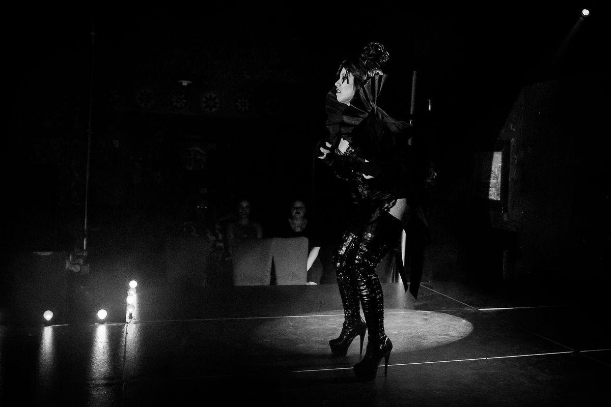 Hana Li onstage dancing as Eliza Cassan in a black-and-white photograph taken at Dallas Burlesque Festvial 2017 at HOB Dallas