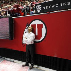 Utah Red Rocks co-head coach Tom Farden watches the area screen during an NCAA gymnastics meet versus the Brigham Young Cougars at the Jon M. Huntsman Center in Salt Lake City, Friday, Jan. 8, 2016.