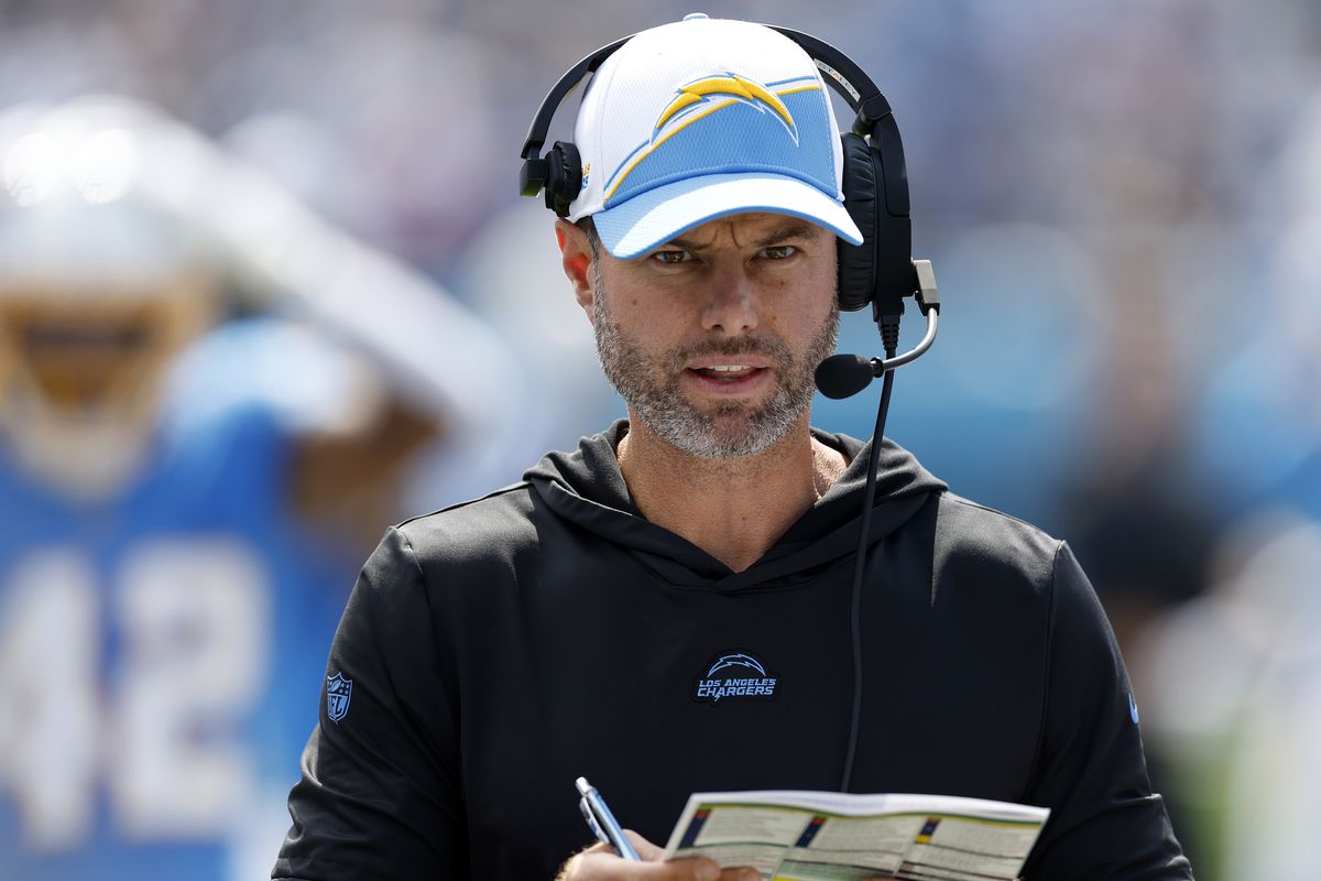 Head Coach Brandon Staley of the Los Angeles Chargers looks at his play call sheet during the first quarter against the Tennessee Titans at Nissan Stadium on September 17, 2023 in Nashville, Tennessee.
