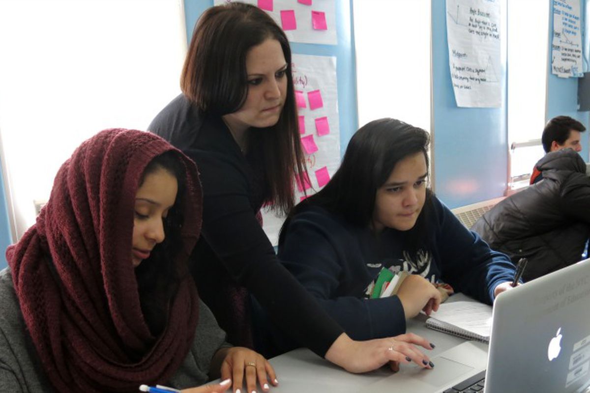 Teach Marisa Laks, center, works with students in 2014 ahead of a Regents exam the following week.