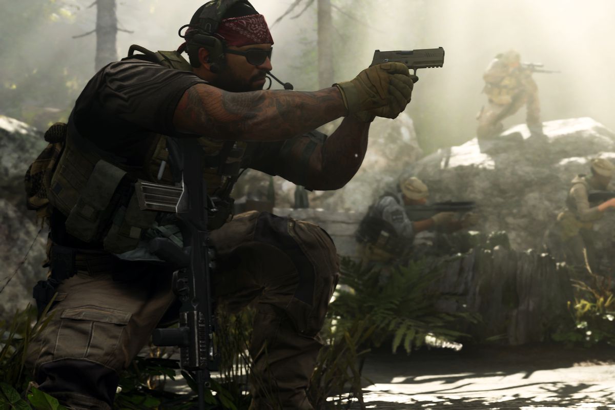 A player wearing sunglasses and a bandana aims a pistol in a rocky forest, with multiple teammates in the background, in a screenshot from Call of Duty: Modern Warfare (2019)