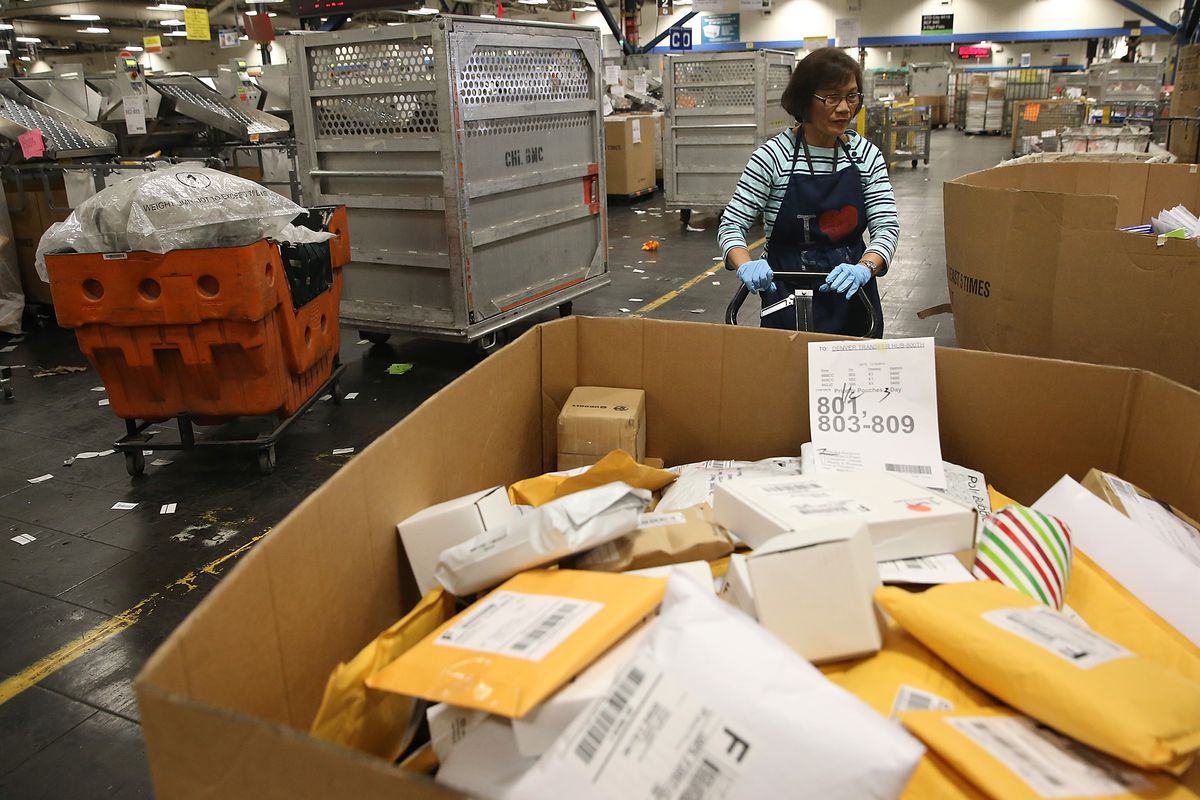 U.S. Post Service Handles Increased Delivery Load For Holiday Season