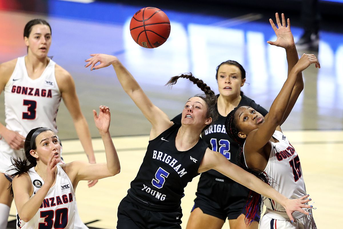 BYU Cougars guard Maria Albiero (5) swipes at the ball as she and Gonzaga Bulldogs forward Yvonne Ejim (15) battle for the rebound in the finals of the West Coast Conference women’s basketball tournament at the Orleans Arena in Las Vegas on Tuesday, March 9, 2021.