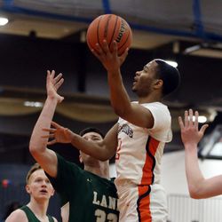 Whitney Young’s Myles Baker (2) shoots over Lane Tech’s Vuk Djuric (33)  in Chicago Friday, March 1, 2019. | Kevin Tanaka/For the Sun Times
