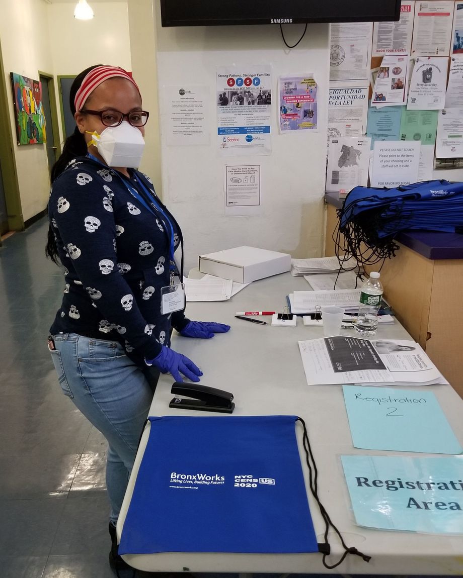 On a recent Saturday, a BronxWorks staffer shares Census information at the food pantry at the Carolyn McLaughlin Community Center on the Grand Concourse.