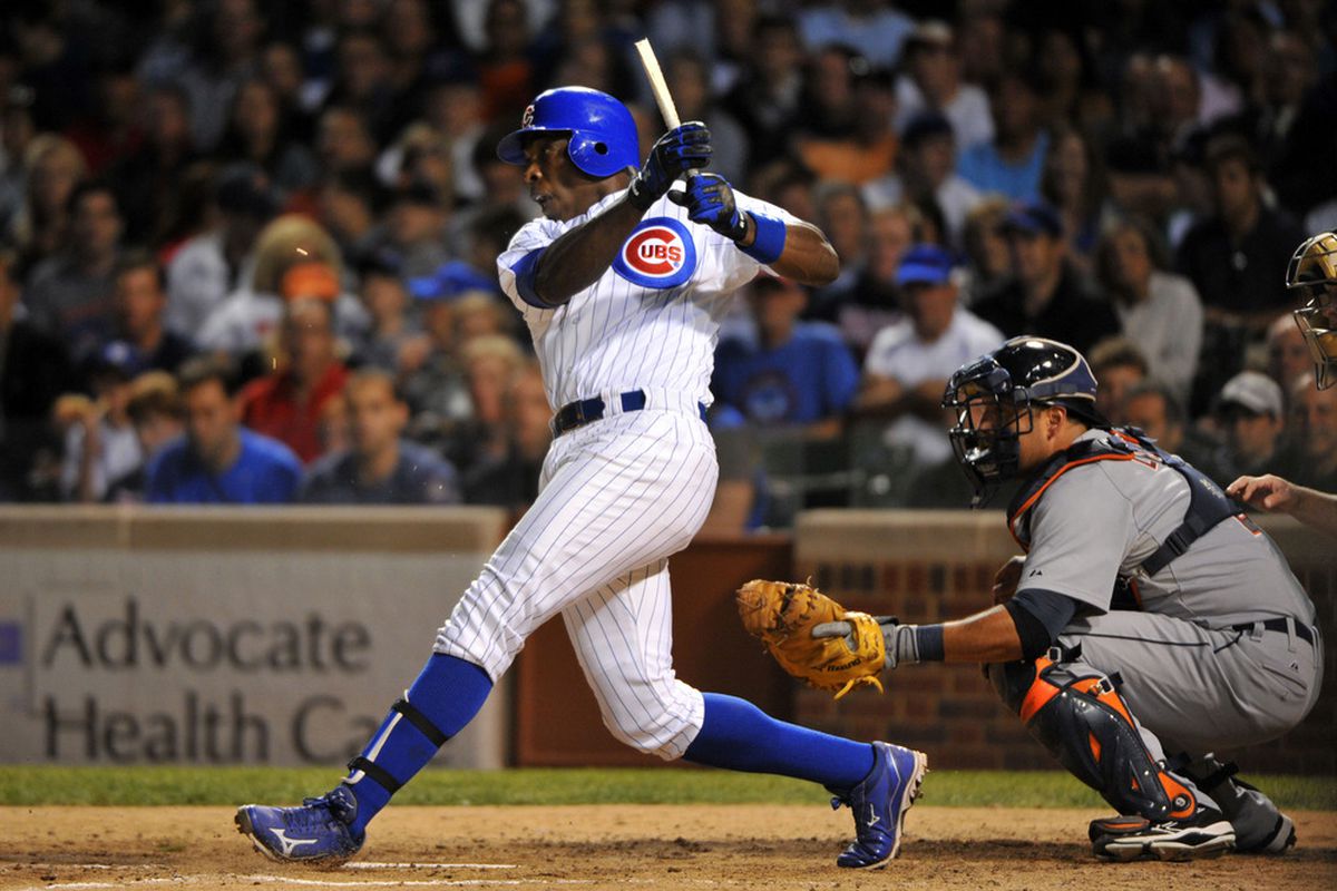 June 12, 2012; Chicago, IL, USA; Chicago Cubs left fielder Alfonso Soriano (12) breaks his bat hitting a single against the Detroit Tigers during the sixth inning at Wrigley Field.  Mandatory Credit: Rob Grabowski-US PRESSWIRE