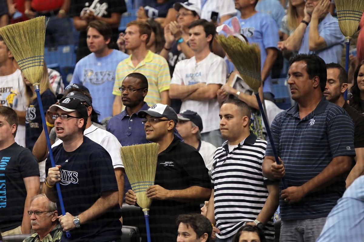 April 8, 2012; St. Petersburg, FL, USA; Tampa Bay Rays fans hold up brooms as the Rays defeated the New York Yankees in three games at Tropicana Field. Tampa Bay Rays defeated the New York Yankees 3-0. Mandatory Credit: Kim Klement-US PRESSWIRE