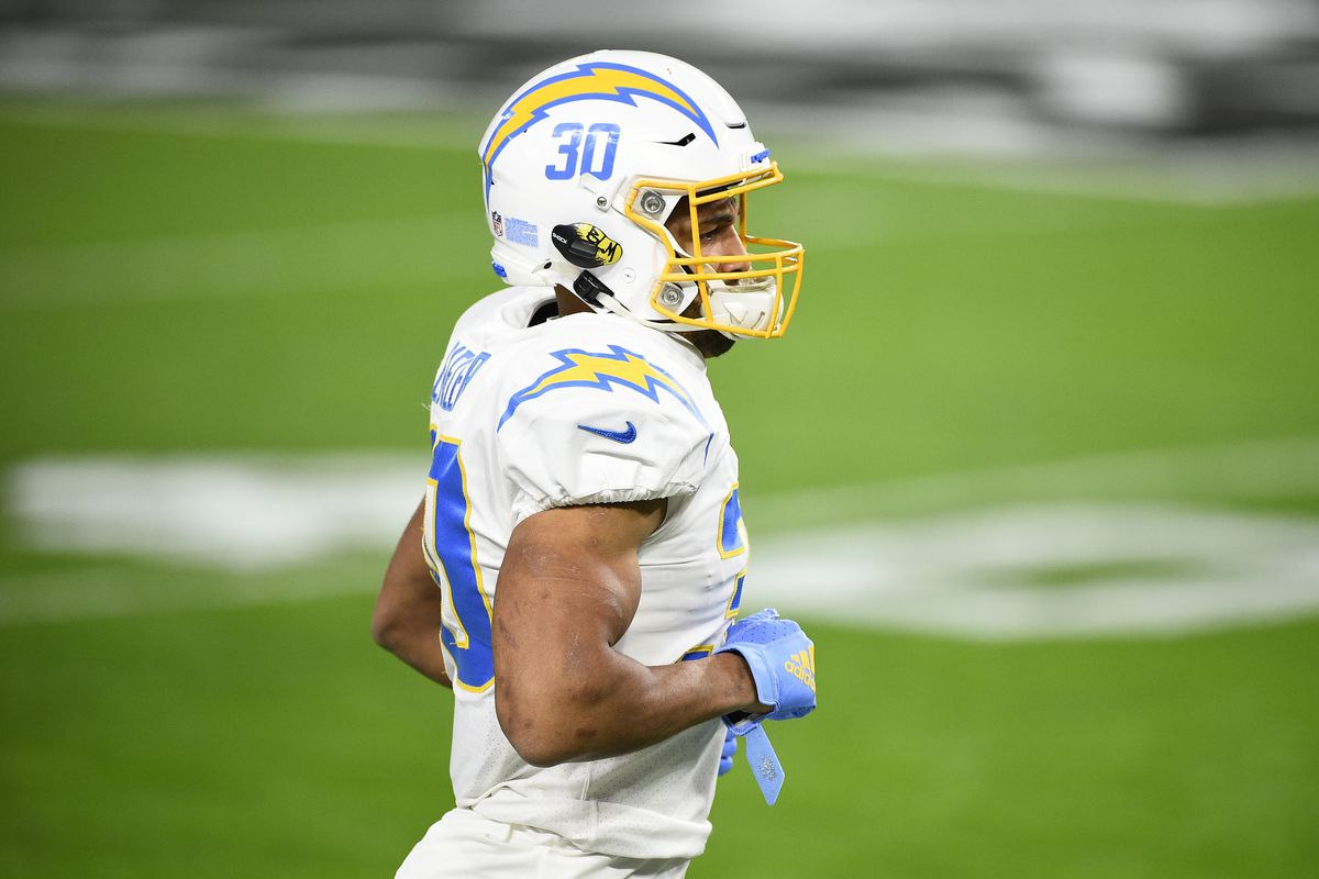 Running back Austin Ekeler #30 of the Los Angeles Chargers runs onto the field during warmups before a game against the Las Vegas Raiders at Allegiant Stadium on December 17, 2020 in Las Vegas, Nevada.