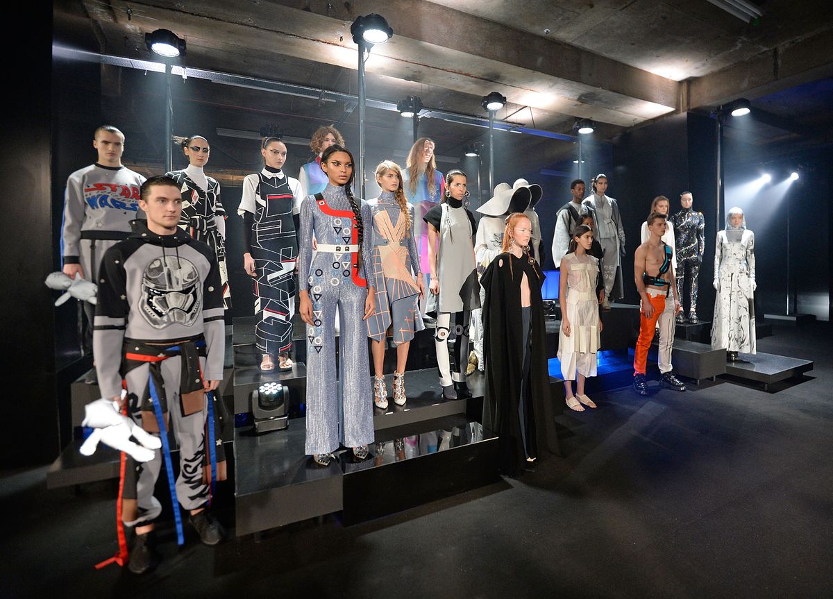 Numerous models pose in futuristic Star Wars-inspired outfits at the Star Wars: Fashion Finds The Force exhibit in London. 