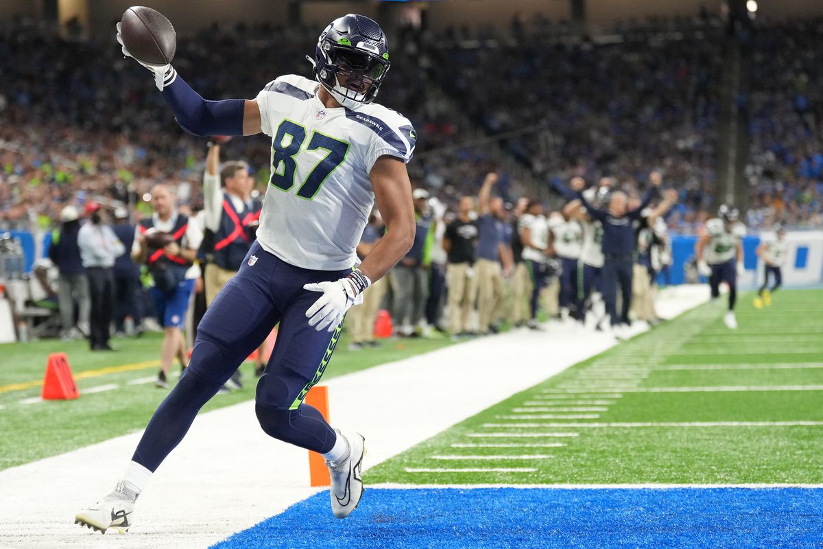 DETROIT, MICHIGAN - OCTOBER 02: Noah Fant #87 of the Seattle Seahawks scores a touchdown against the Detroit Lions during the second quarter at Ford Field on October 02, 2022 in Detroit, Michigan.