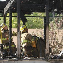 Unified firefighters work on a house fire at 1107 W. 4800 South in Taylorsville Friday, June 14, 2013.